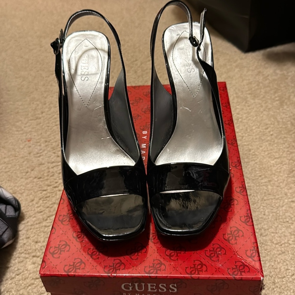 Guess Black sling back stilettos sandals.